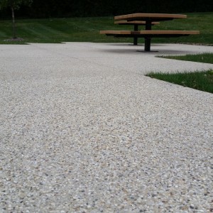 Exposed aggregate patio with park tables